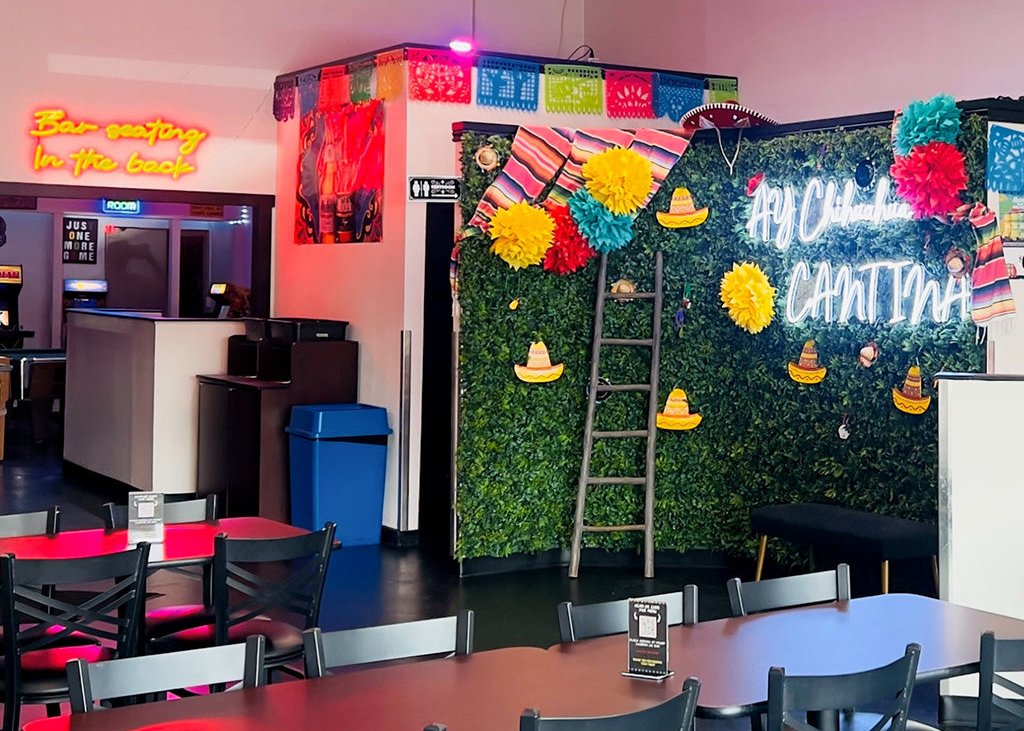 The main dining area of Ay Chihuahua Cantina, featuring a vibrant and colorful interior with a mix of modern and traditional Mexican decor.